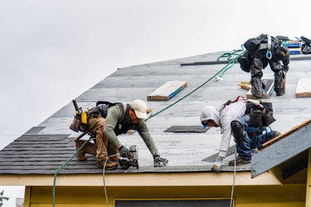 Professional Roofing technician working in Riverside, CA